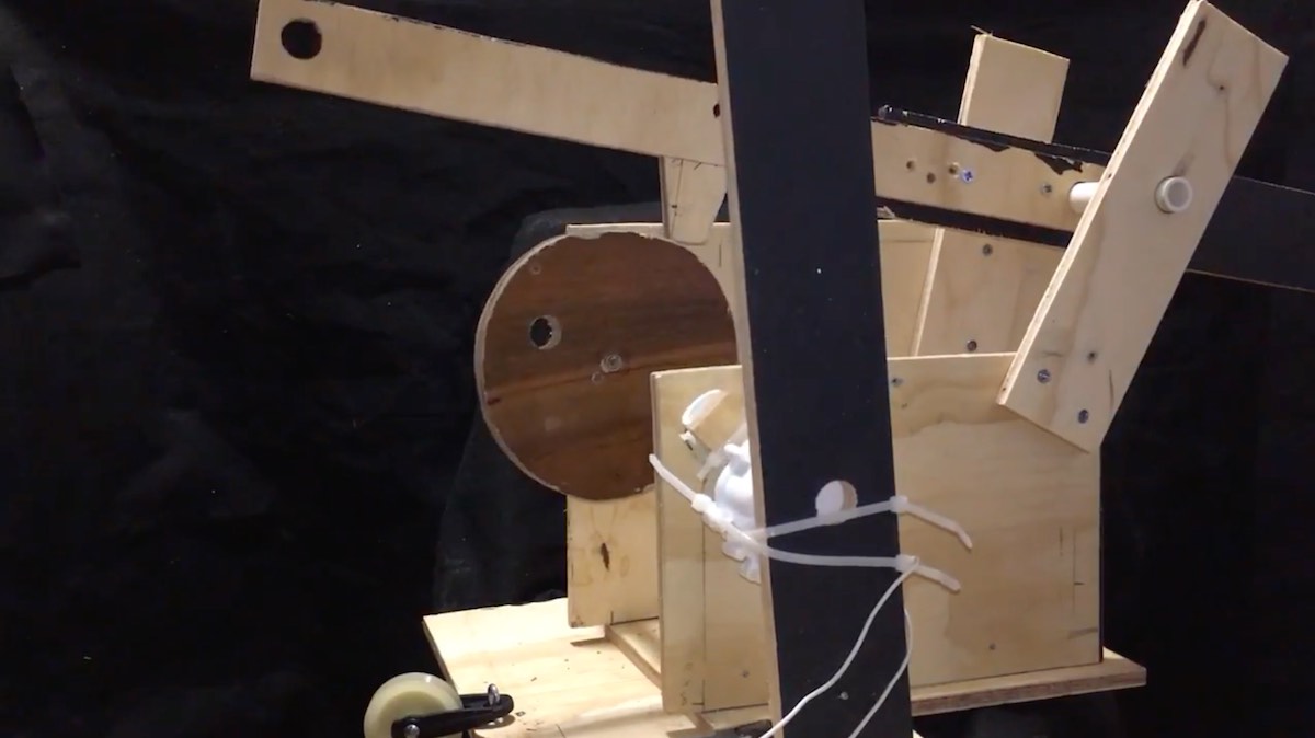 A mockup of the animation rig in plywood.