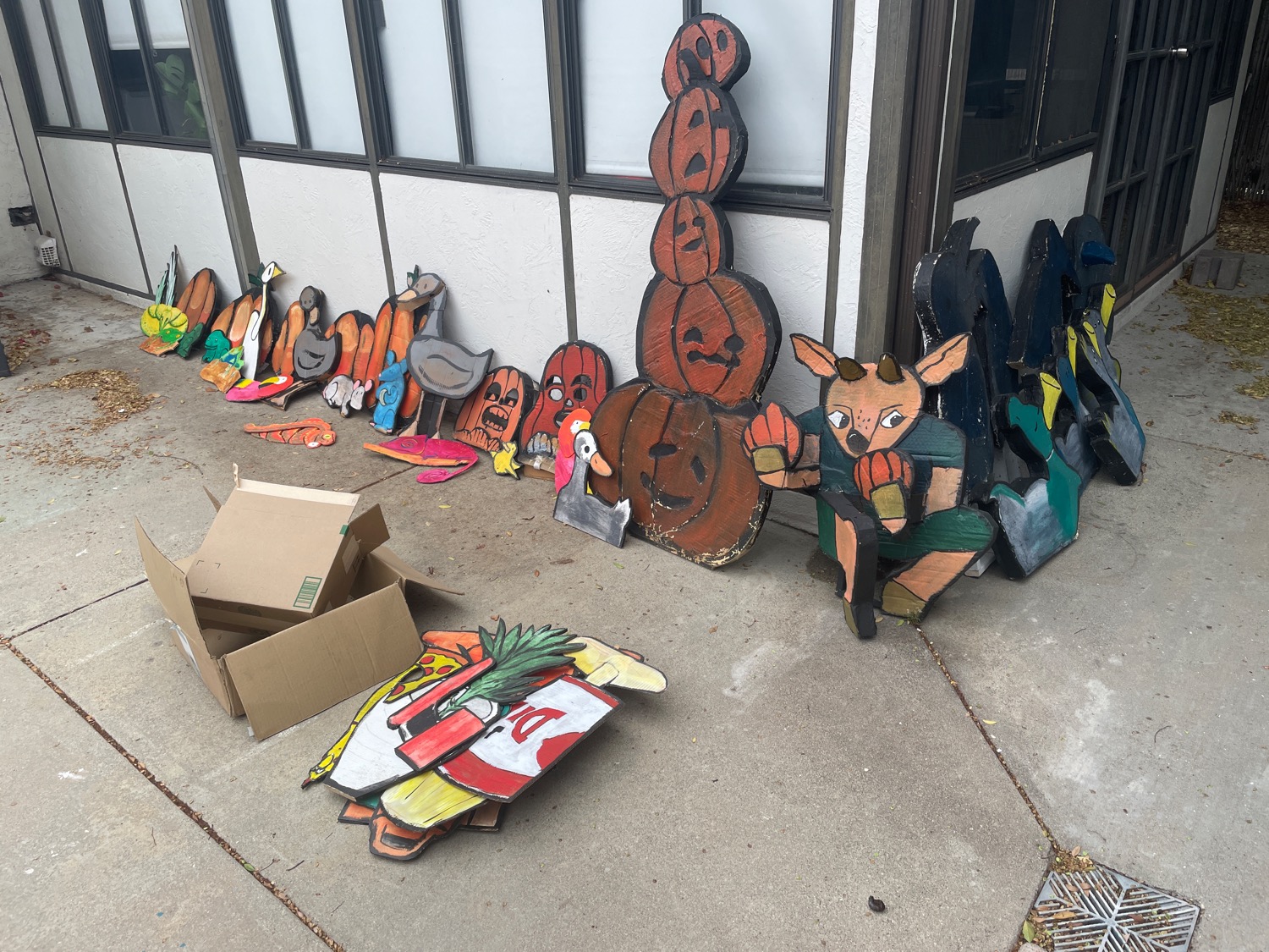 A whole mess of old cardboard cutouts in various states of disrepair