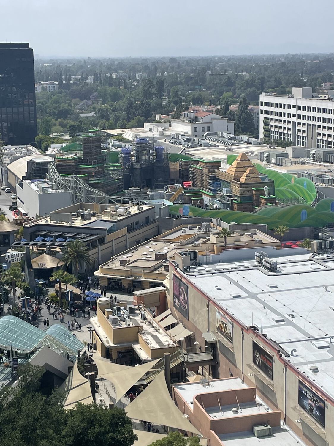 An overhead view of the lower lot at Universal Studios Hollywood, the unfinished Super Nintendo World visible in the distance