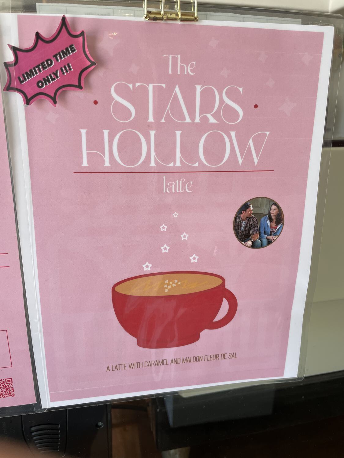 A flyer in a coffee shop advertising "The Stars Hollow latte," complete with a tiny photo from Gilmore Girls