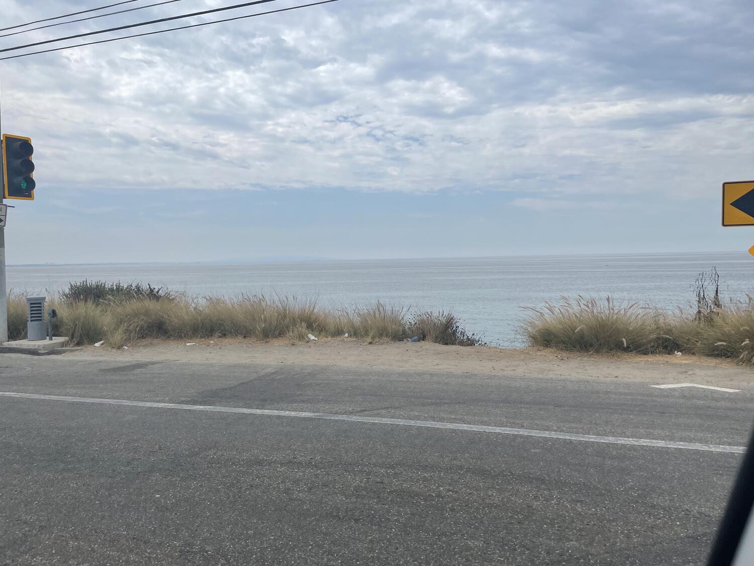 The ocean from the Pacific Coast Highway. It's a gloomy, gray day.