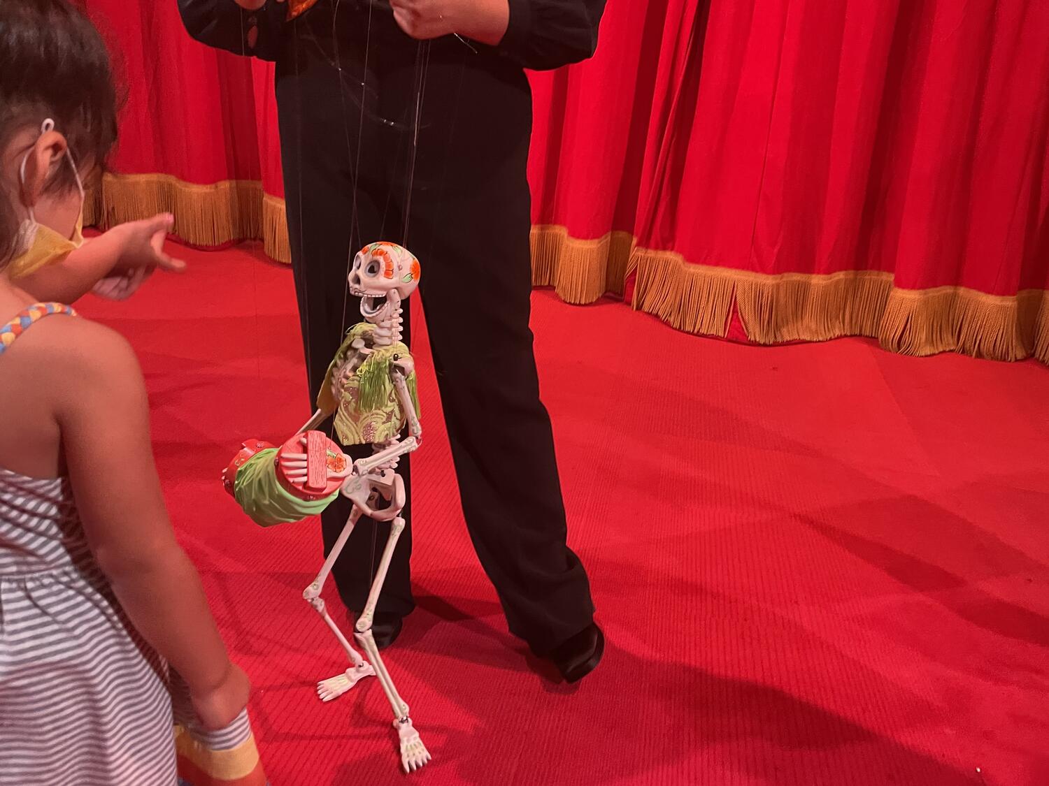 A skeleton puppet with an accordion