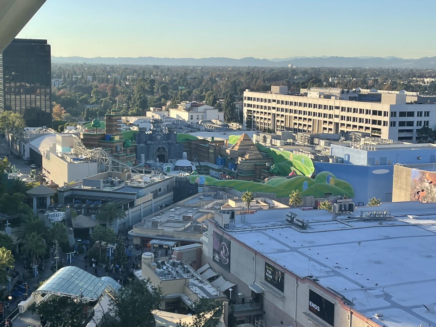 A distant shot of the new Super Nintendo World at Universal Studios as seen from the escalators, still under construction but looking close to finished.