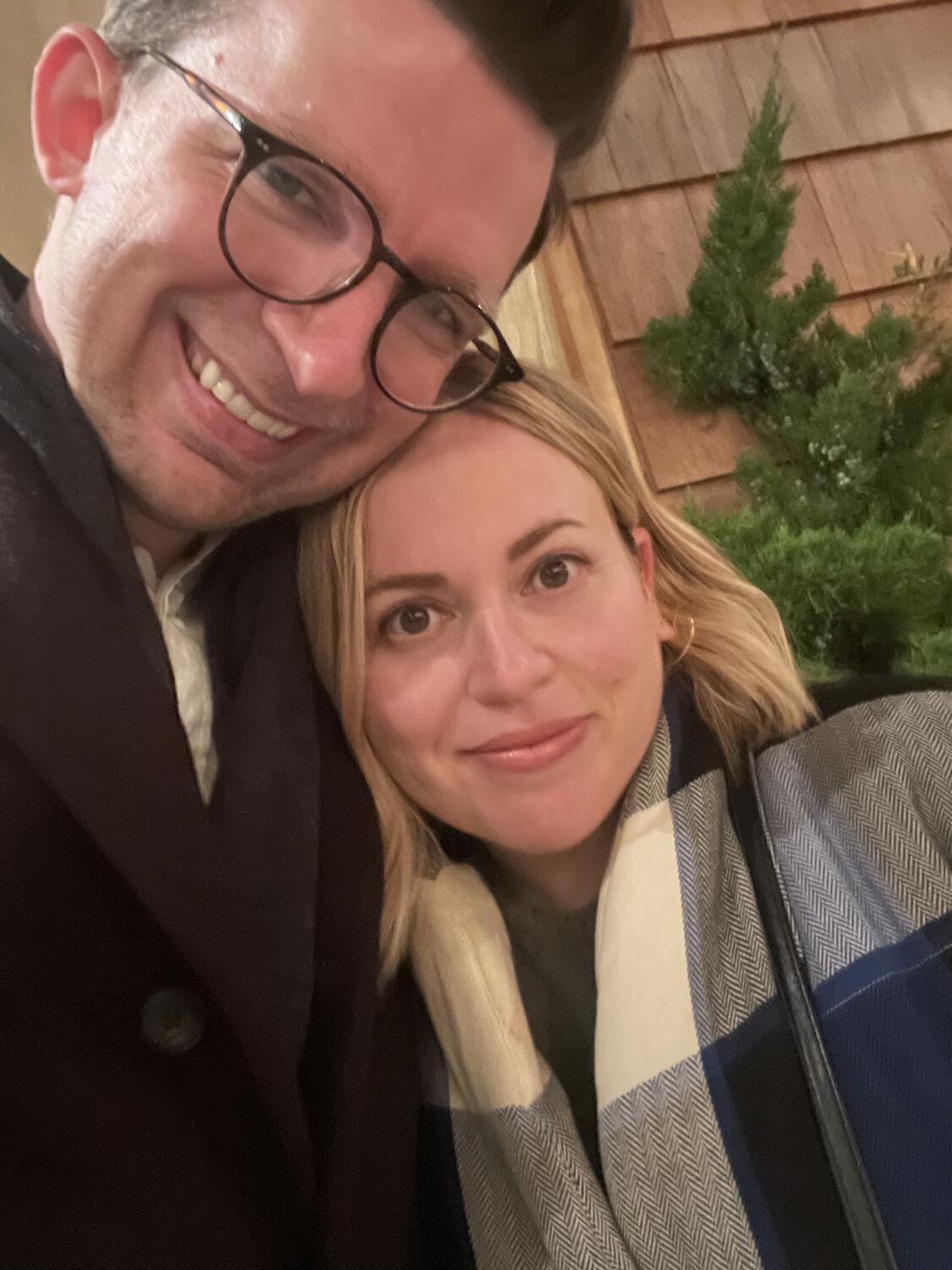 A selfie with Amy, we're outside in big coats and looking chilly but very happy