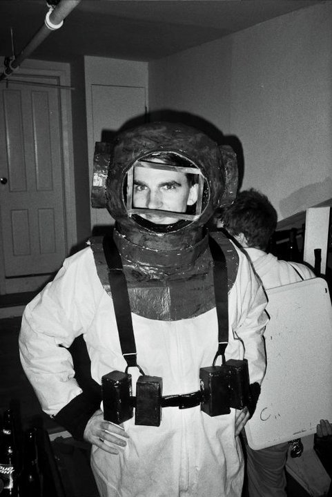 A black-and-white photo of me posing at a party in a handmade deep sea diver costume