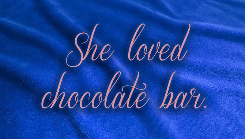 The words “She loved chocolate bar” in a light pink script font over a deep blue background.